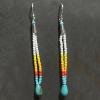 07_Glass seed beads, Turquoise, Sterling silver cone and ear wire 2.25" $58